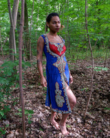 This royal blue dress with refined red accents and silver-gold embroidery is a true statement piece. The elegant beadwork highlights its timeless design, making it perfect for special occasions.