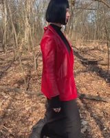 This vintage red leather jacket from the 80s is anything but outdated. With light shoulder pads to add structure, it's the statement piece!