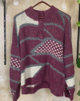 Add a pop of pink to your wardrobe with our vintage 80s wool sweater, featuring a geometric pattern.