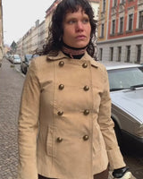 Introducing the y2k beige/cream brown Dino'z leather jacket! Complete with dark golden buttons and light shoulder pads, this jacket is just timeless! 