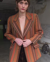 Get the ultimate 70s look with this vintage brown orange striped blazer! No buttons, just pure elegance. Perfect for any 70s enthusiast.