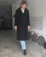 Wrap yourself in elegance with this vintage 80s 90s black real fur coat. This timeless piece adds a touch of luxury to any outfit. 