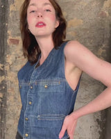 This vintage denim vest is tough, timeless, and ready to layer. It features classic brass snap buttons and four front pockets for that old-school workwear vibe.