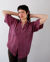 a woman is wearing a 80s vintage burgundy silk short sleeve blouse shirt