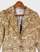 a woman is wearing a coat.