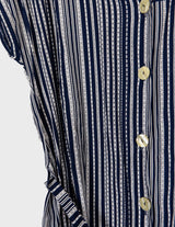 a woman is wearing a 90s vintage striped belted midi dress.