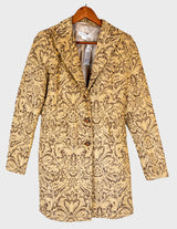 a woman is wearing a coat.