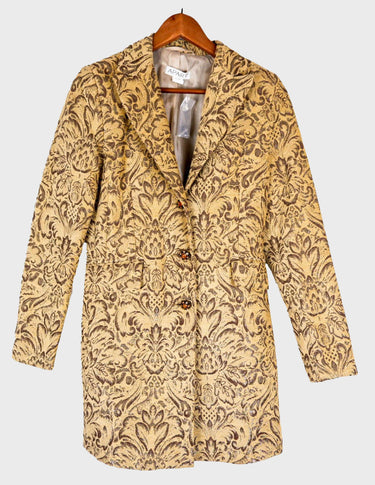 a woman is wearing a coat.