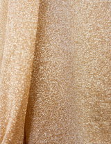 a woman is wearing a glitter blouse.