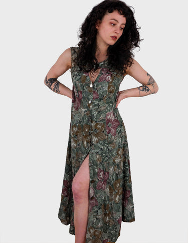 a woman is wearing a vintage 80s 90s floral boho maxi dress.