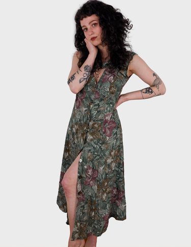 a woman is wearing a vintage 80s 90s floral boho maxi dress.