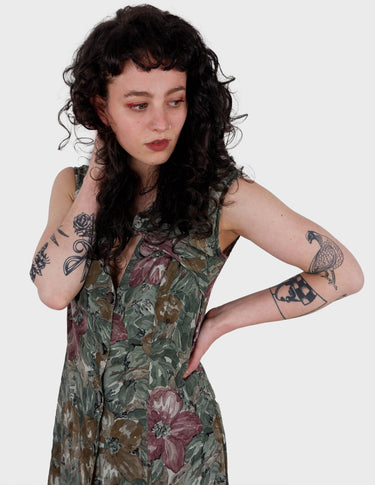 a woman is wearing a vintage 80s 90s floral boho maxi dress.