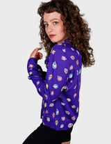 a woman is wearing a purple shirt.