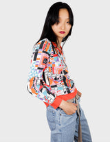 a woman is wearing a colorful shirt.