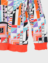a woman is wearing a colorful shirt.