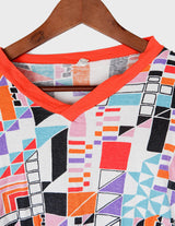a woman is wearing a colorful shirt.