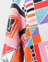 a woman is wearing a colorful shirt.