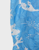 a woman is wearing a cotton asian dress.