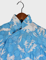 a woman is wearing a cotton asian dress.