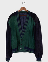 a man is wearing a 80s vintage green jacket.
