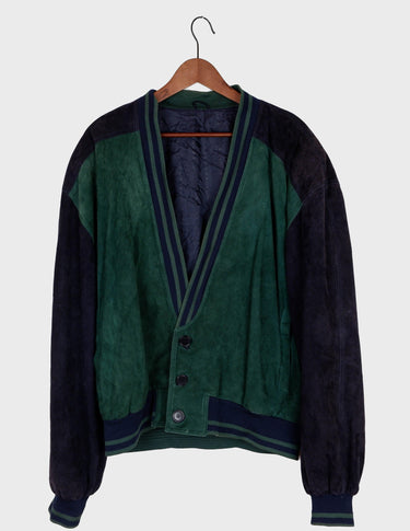 a man is wearing a 80s vintage green jacket.