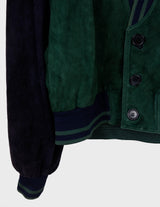 a man is wearing a 80s vintage green jacket.