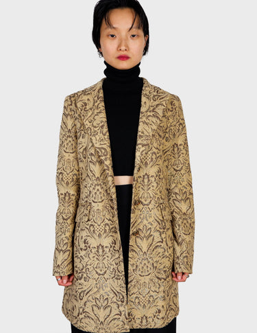 a woman is wearing a coat.
