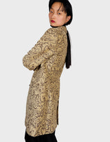 a woman is wearing a coat.