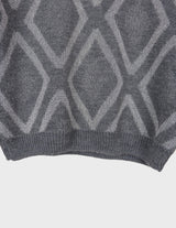 a woman is wearing a 80s vintage glitter sweater.