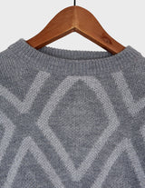 a woman is wearing a 80s vintage glitter sweater.