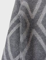 a woman is wearing a 80s vintage glitter sweater.
