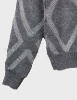 a woman is wearing a 80s vintage glitter sweater.