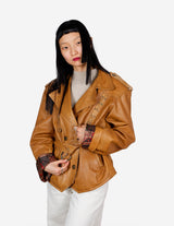 a woman is wearing a brown leather jacket.
