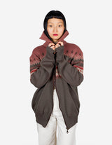 a woman is wearing a cardigan.
