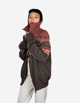 a woman is wearing a cardigan.