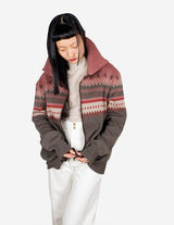 a woman is wearing a cardigan.