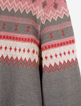 a woman is wearing a cardigan.