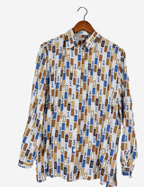 a woman is wearing a arty look blouse.