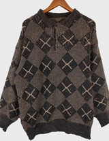 a woman is wearing a 80s brown vintage abstract pattern sweater.