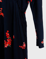 a woman with blonde hair is wearing a vintage 80s 90s floral maxi dress.
