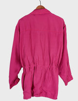 a blonde woman is wearing a 80s vintage silk jacket.