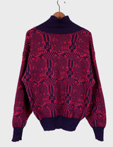 a woman is wearing a 80s dark pink geometric turtleneck sweater.