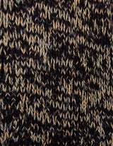 a woman is wearing a brown sweater.