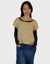 a woman is wearing a vintage 70s handknitted slipover.