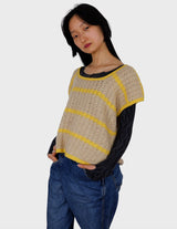 a woman is wearing a vintage 70s handknitted slipover.