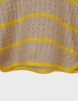 a woman is wearing a vintage 70s handknitted slipover.