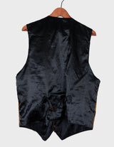 an asian woman is wearing a 90s vintage brown vest with historical pattern.