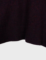 an asian woman is wearing a pink sweater.