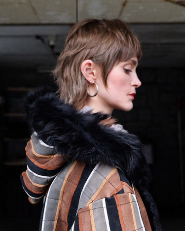 Embrace statement pieces like our premium handmade vintage 70s long multi-color leather coat! Expertly crafted with leather and a luxurious real fur lining, this statement piece blends bold style with cozy warmth. Perfect for those who love unique fashion - this coat is a must-have for size M - L.