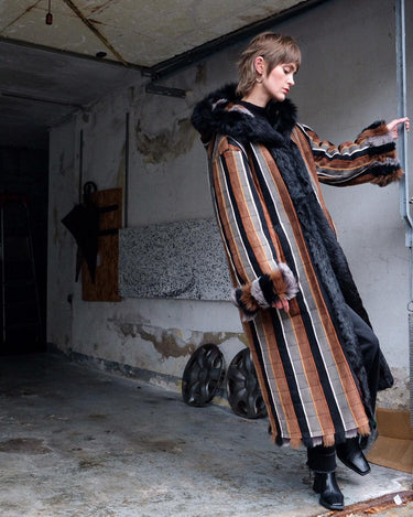 Embrace statement pieces like our premium handmade vintage 70s long multi-color leather coat! Expertly crafted with leather and a luxurious real fur lining, this statement piece blends bold style with cozy warmth. Perfect for those who love unique fashion - this coat is a must-have for size M - L.